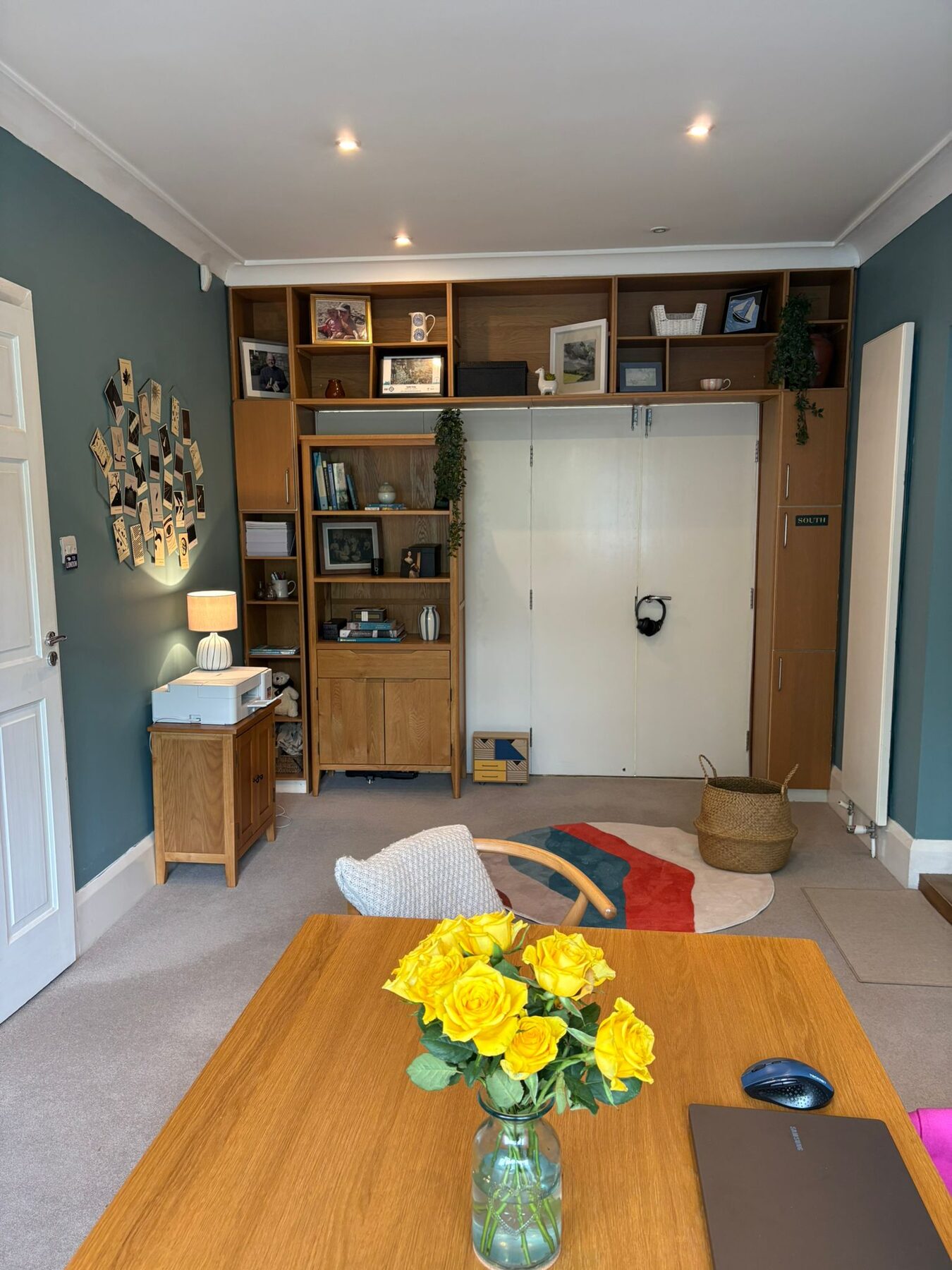 The assessment room, with its table, chairs and fresh flowers